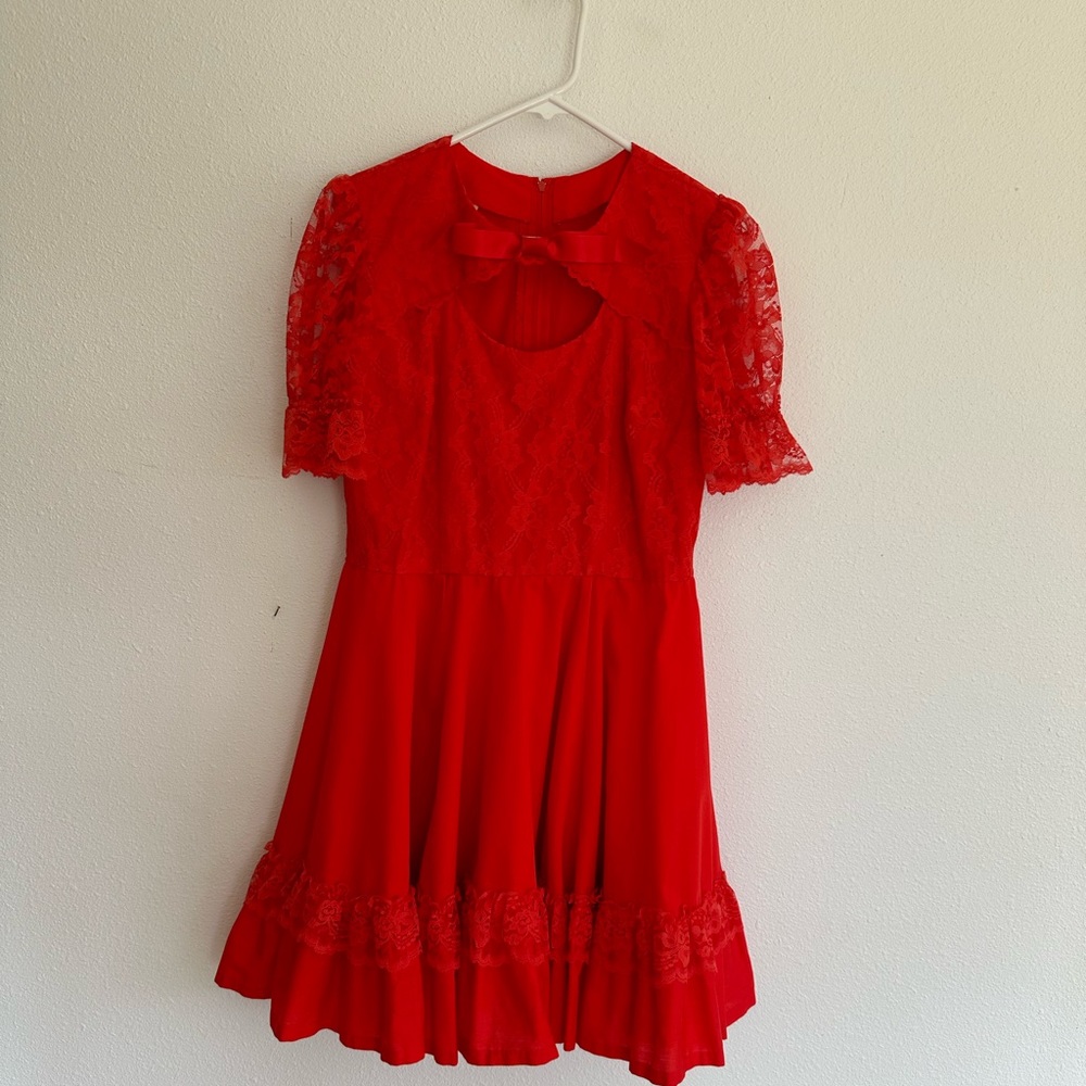 Red poly/cotton dress with lace top on bodice. Vintage 14 so check measurements.